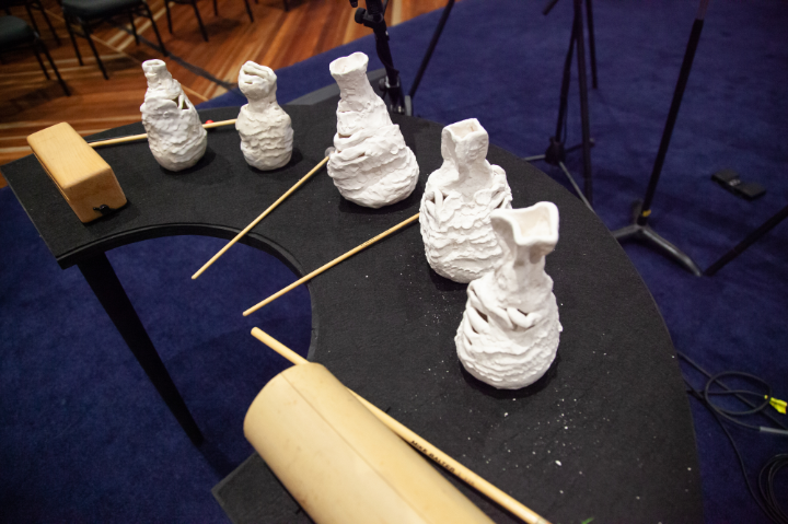 Table with numbered white ceramic instruments arranged.